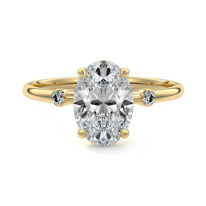 1.5 carat oval trilogy lab grown diamond engagement ring in 18K yellow gold